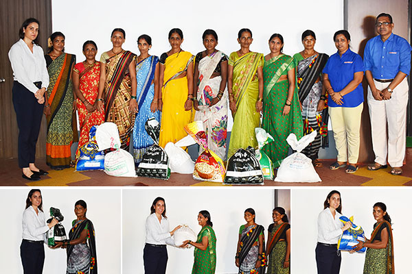 Powermaster distributes monthly household supplies to the ladies of the community